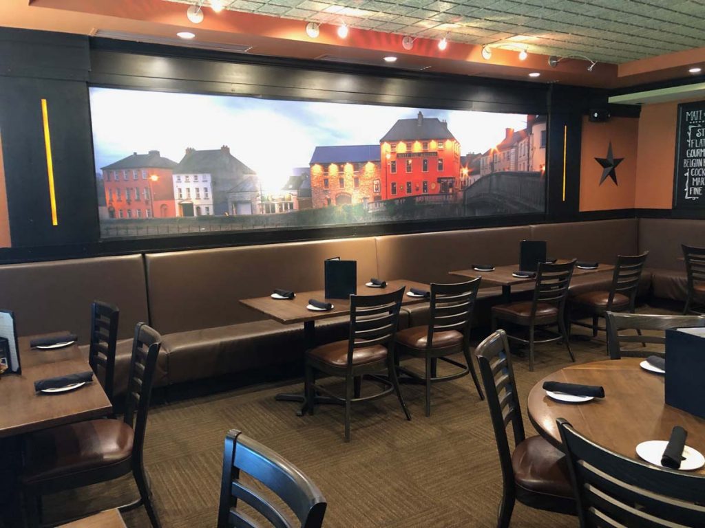 Mural on wall showing Irish pubs in dining room at Matt the Miller’s Tavern Dublin, Ohio location