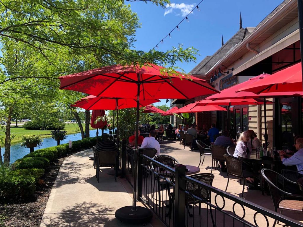 Outdoor patio with red umbrellas at Matt the Miller’s Dublin location